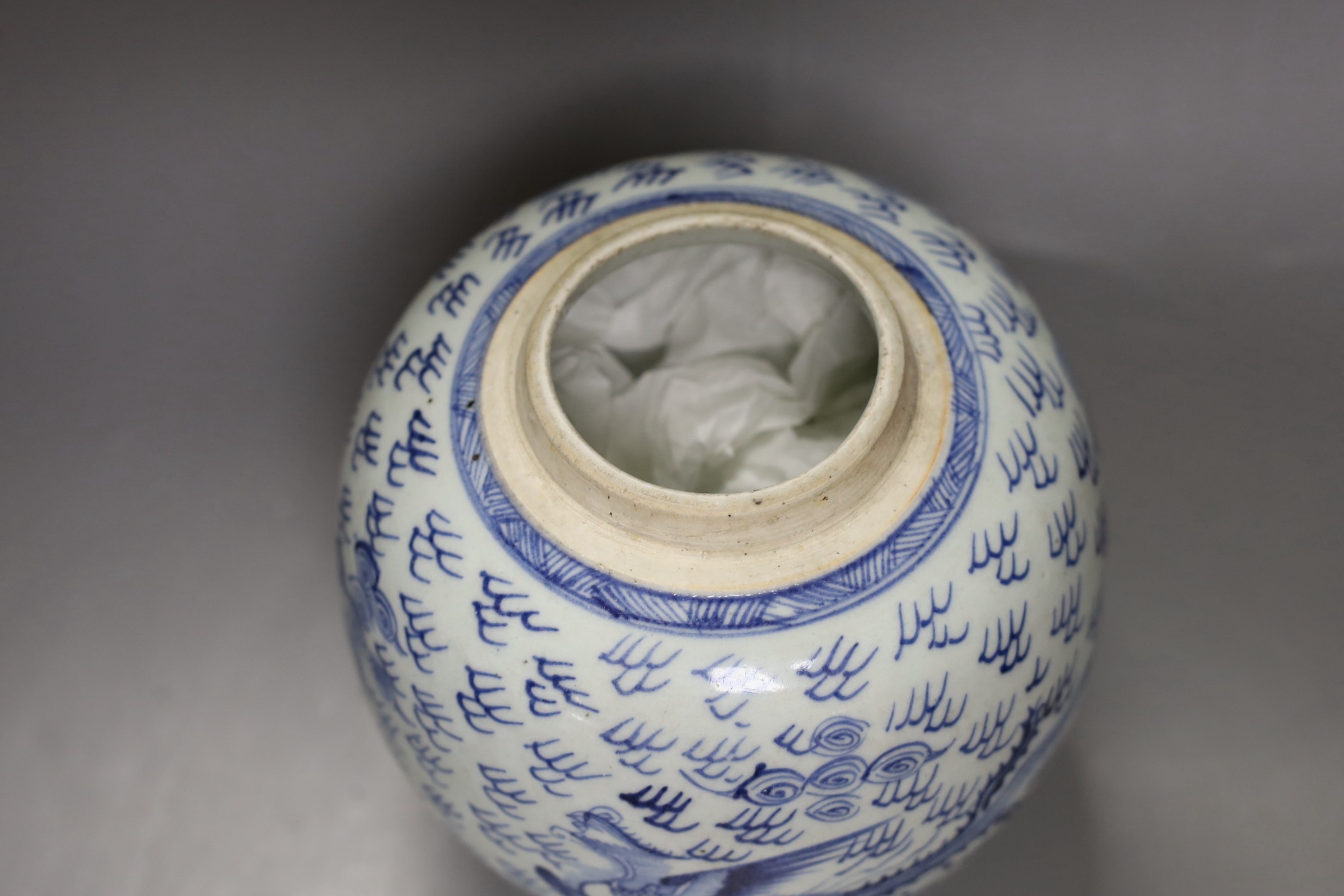 An 18th century Chinese provincial blue and white ‘dragon and phoenix’ jar, 19cm